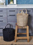 Kata Basket with Handle Black set styled in living room as floor storage, Calmly Elevated