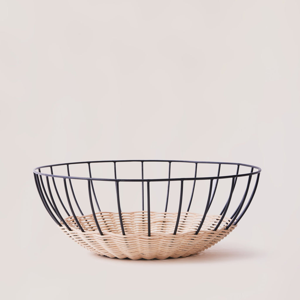 Cabo rattan basket empty showing natural weave and powder-coated frame — Calmly Elevated