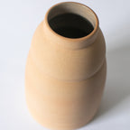 Chubby terracotta vase viewed from above showing its dark glazed interior