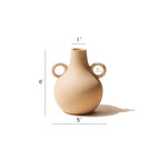 Cream Harappan vase with size markings showing roughly 6 inch height