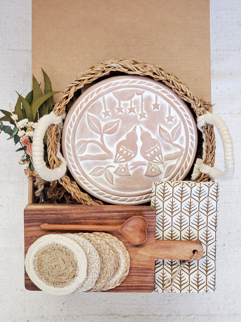 Bread warmer gift box open showing terracotta stone, acacia board and wooden spoon — Calmly Elevated