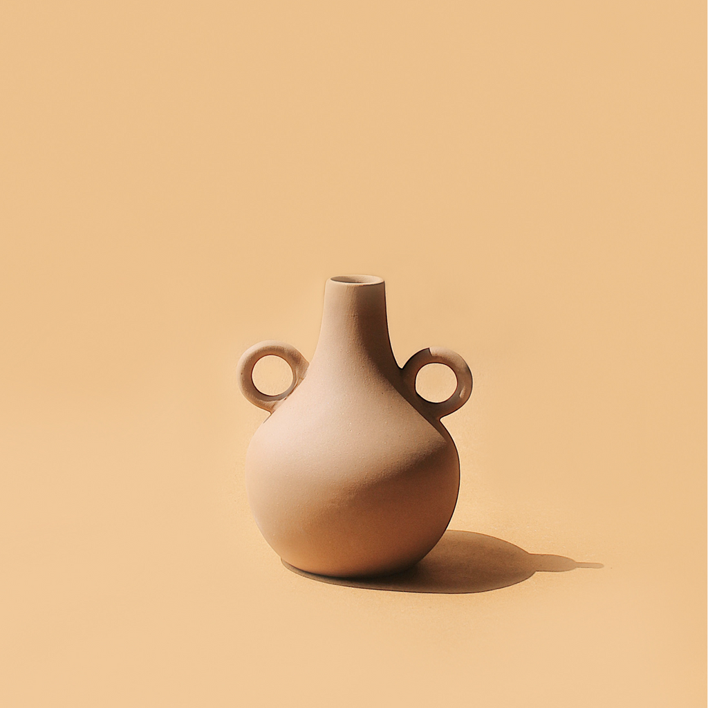  Handmade tan jug vase with narrow neck and sculptural ring handle
