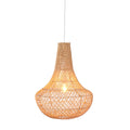 Handwoven Ibiza rattan pendant light with a tall tapered shade glowing softly against a white background