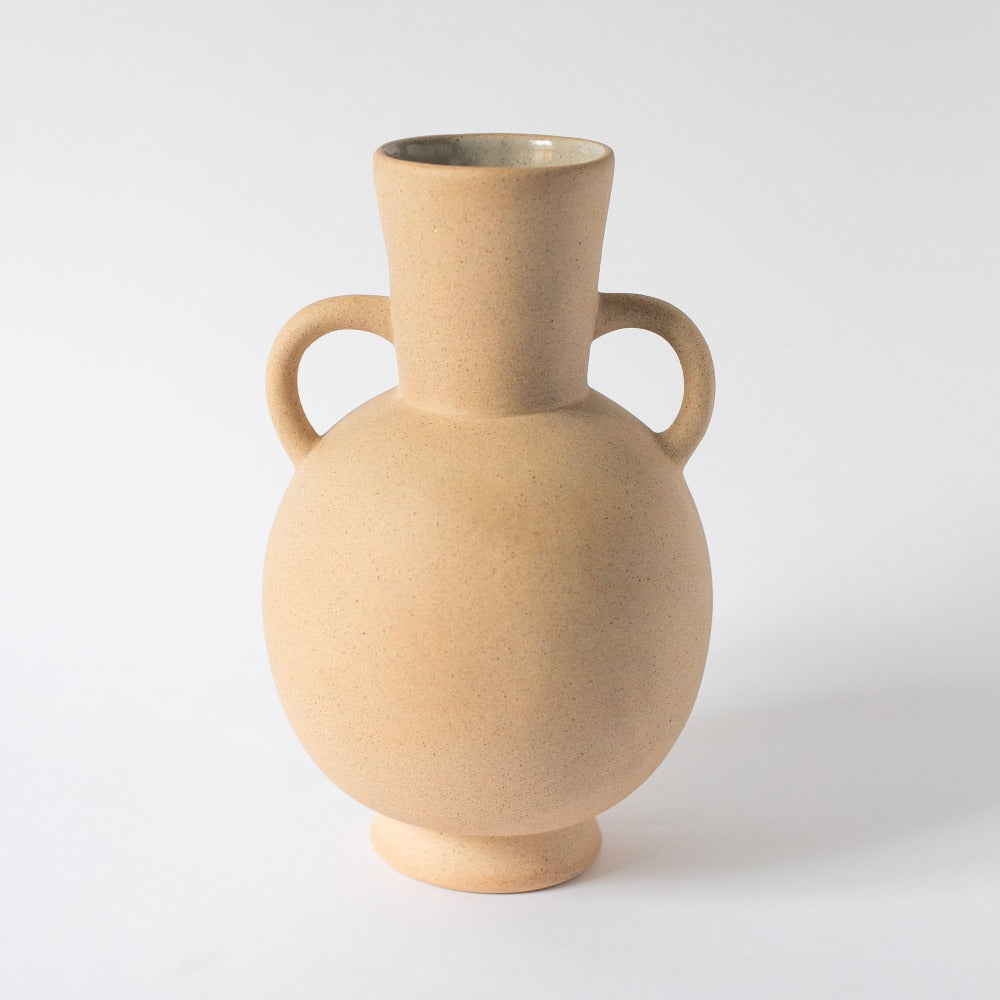 Light terracotta Tirreno amphora vase with rounded body and curved handles on a white background