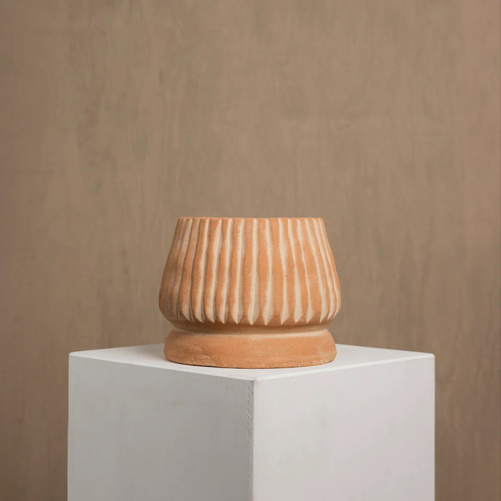 Mateo handmade terracotta pot styled on floor with greenery — Calmly Elevated
