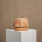 Mateo handmade terracotta pot styled on floor with greenery — Calmly Elevated