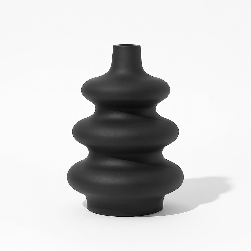 Matte black Mezo ceramic vase with rounded stacked tiers on a clean white background