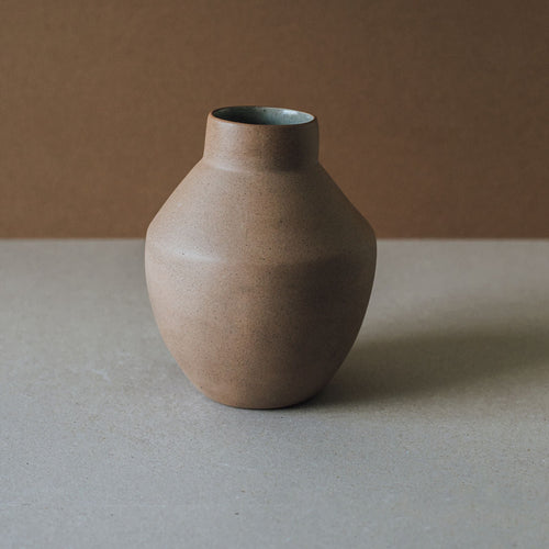 Wheel thrown Al Centro terracotta vase with a rounded urn form and short neck