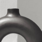 Half Polo black vase styled with dried botanicals on minimalist shelf — Calmly Elevated