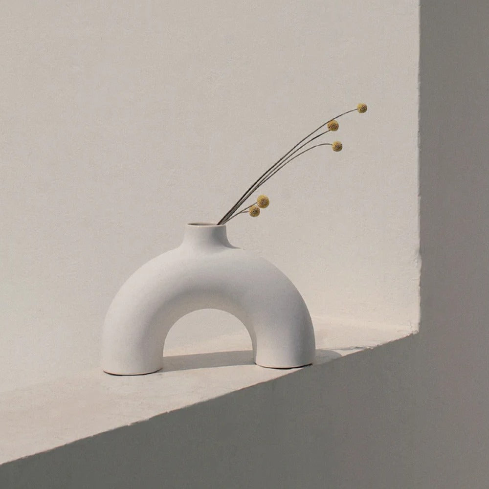 Half Polo white vase side view showing sculptural half-form silhouette — Calmly Elevated