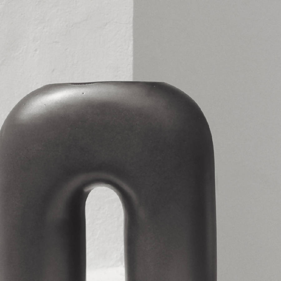 Zo black inverted-U sculptural ceramic vase by Osmos Studio — Calmly Elevated