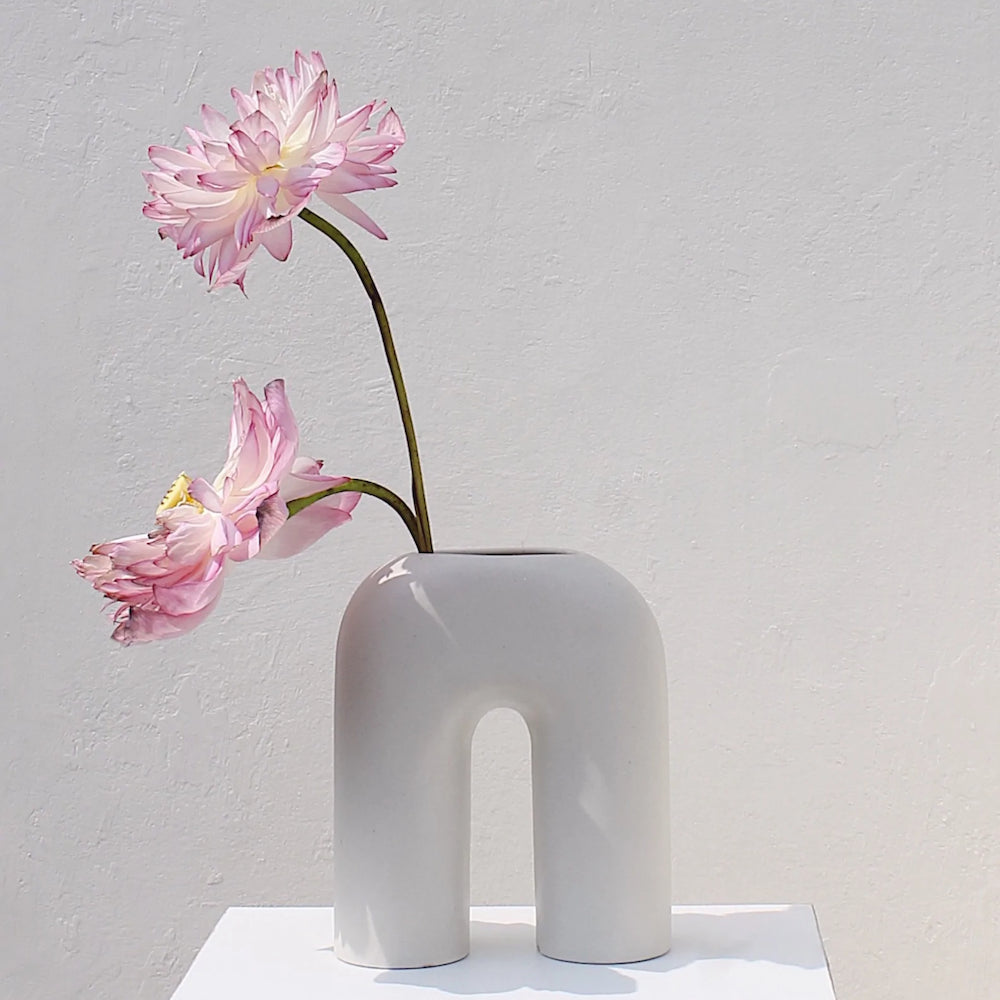 Zo white sculptural vase styled as contemporary art object on console —Calmly Elevated